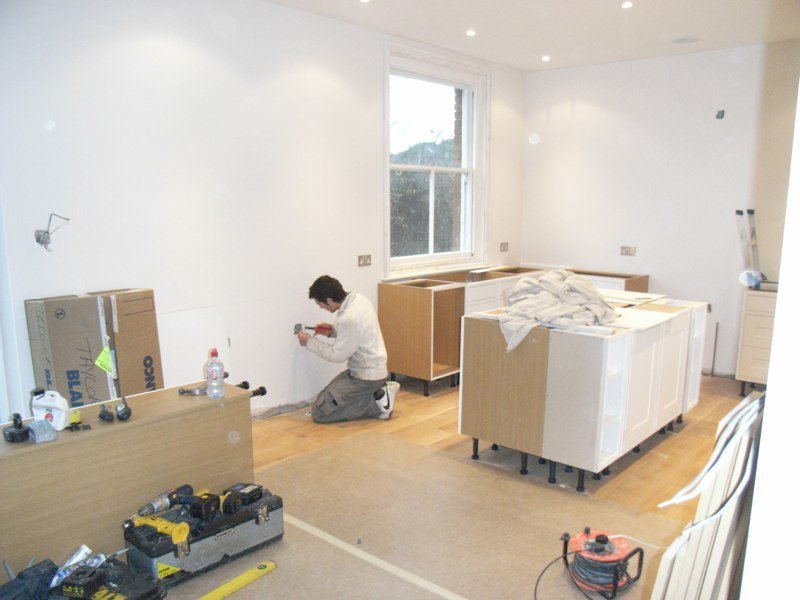Kitchen units being fitted in the new extension